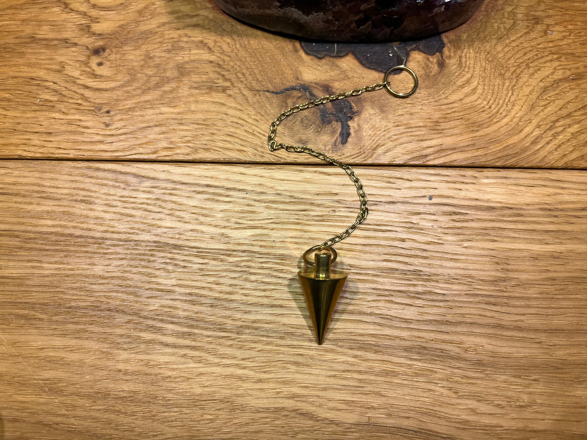 Pendule cone débutant doré